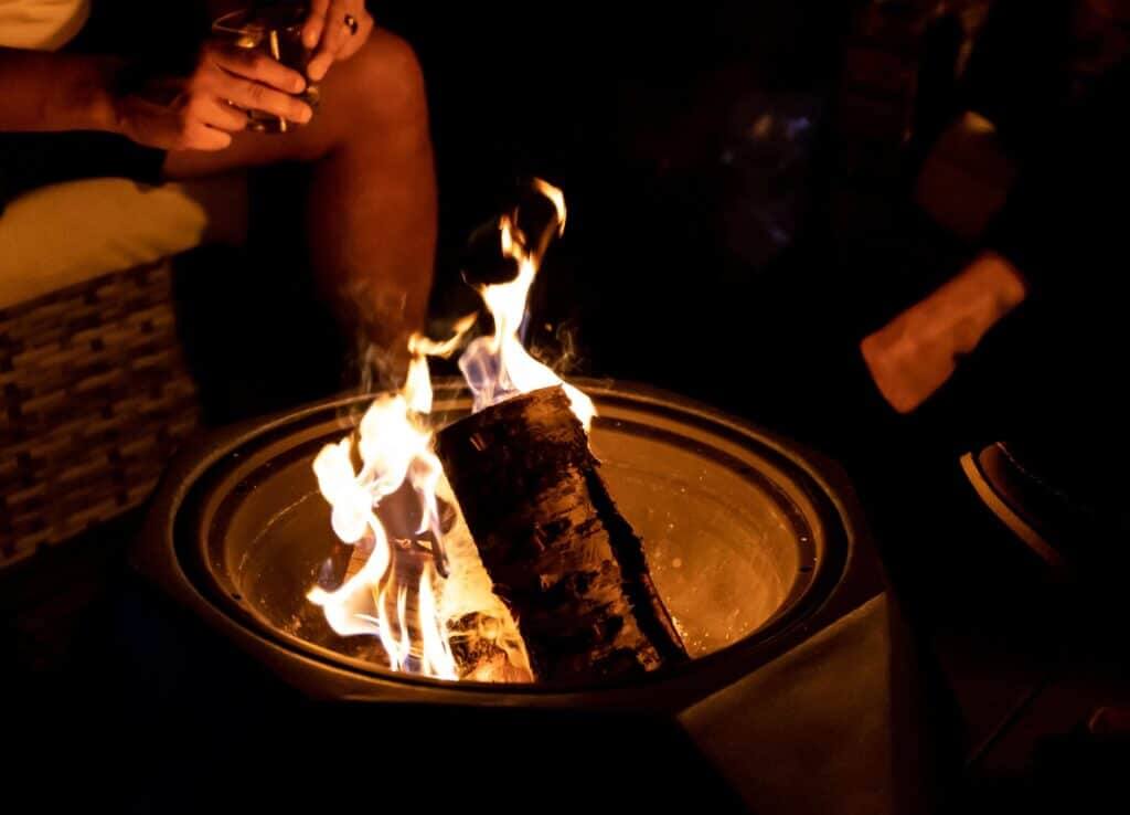 coaching clients by cozy fire pit