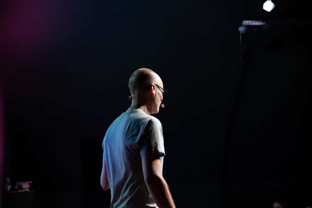 Breaking Free from Fear of Public Speaking: The "You" Strategy 2 matteo cassese international keynote speaker berlin on stage at factory