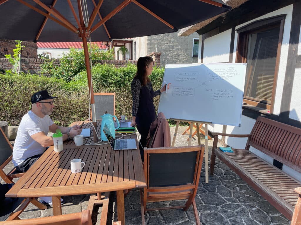 collaboration at the whiteboard in the myth maker farm garden
