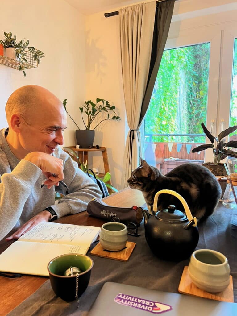 matteo cassese stares into the eyes of a clients cat