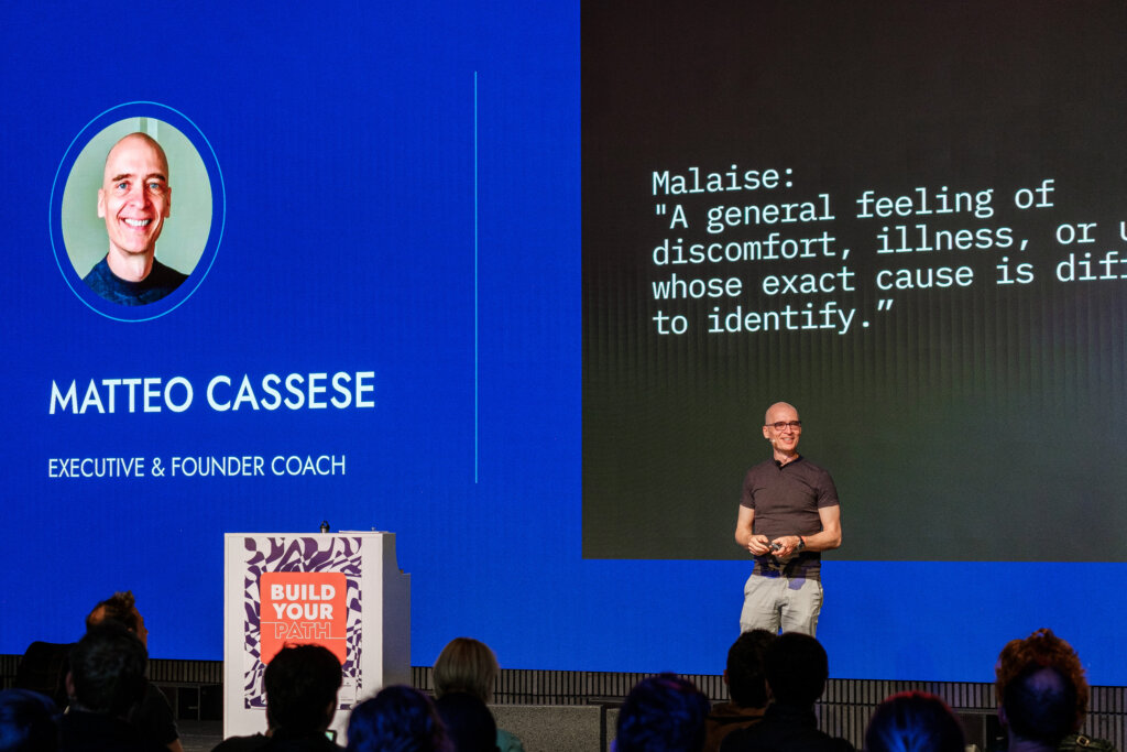 Matteo Cassese keynote speaker on stage at Freelance Unlocked Berlin 2025