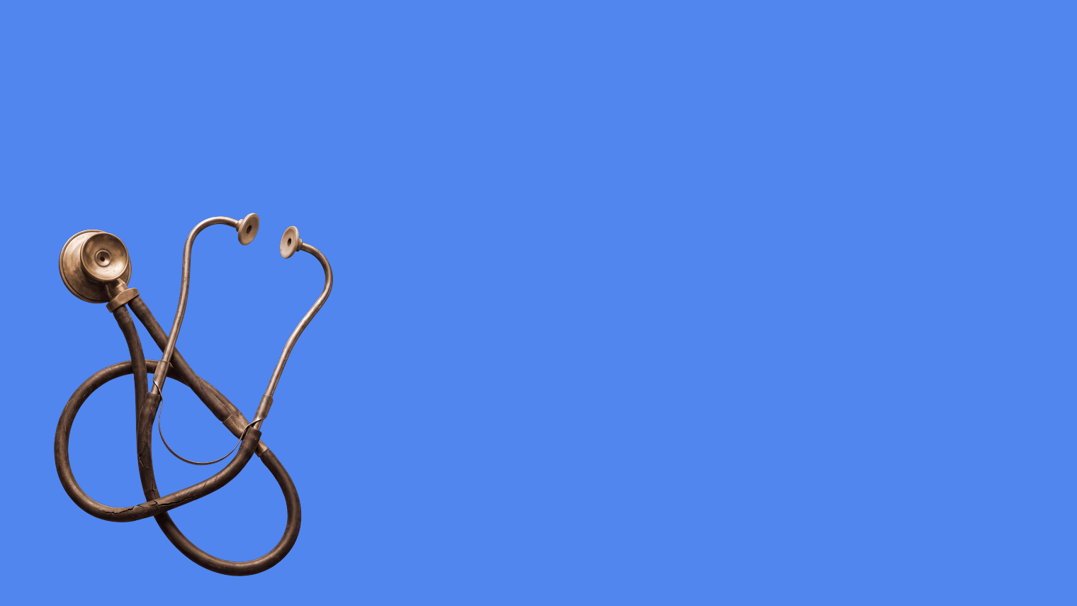 An antique stethoscope lying coiled with both earpieces empty on a sky blue ground
