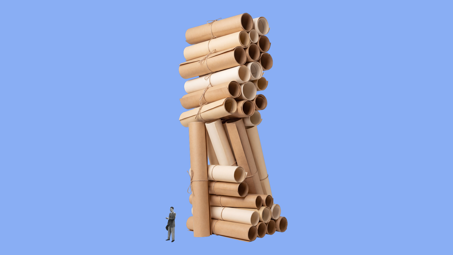 A tiny figure standing at the foot of a leaning tower of rolled papers about to topple, on a light-blue background.